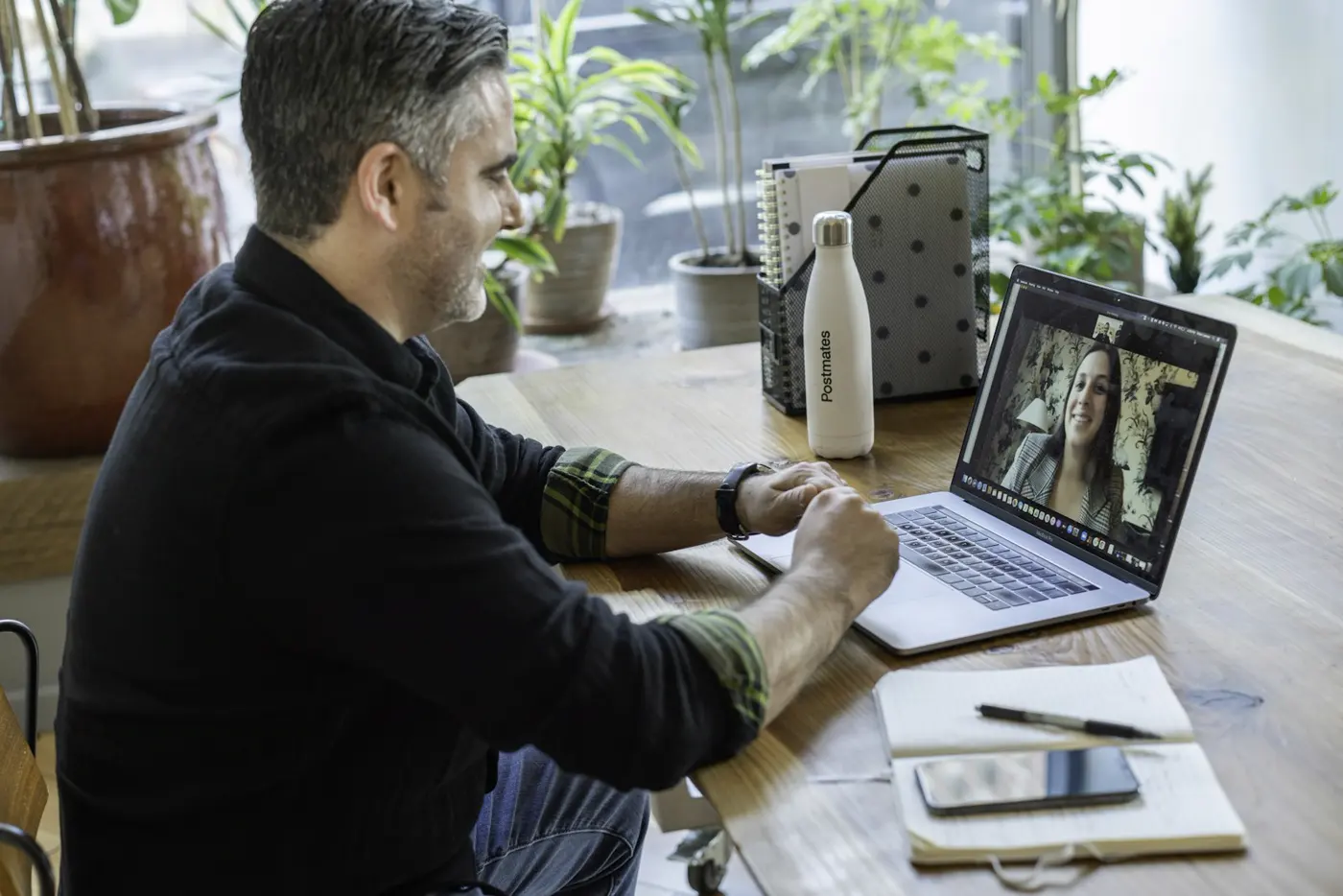 A man at home on a video visit with his provider